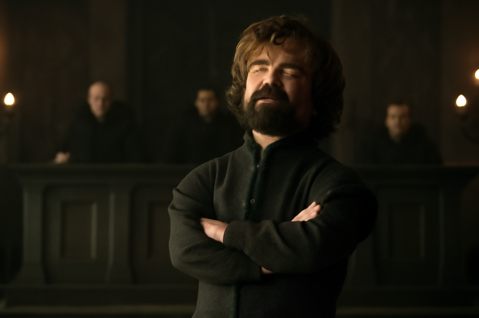 Tyrion Lannister standing confidently with arms crossed in the King's Landing courtroom, delivering a defiant yet humorous expression. The stern judges are in the background, creating an intense atmosphere." 